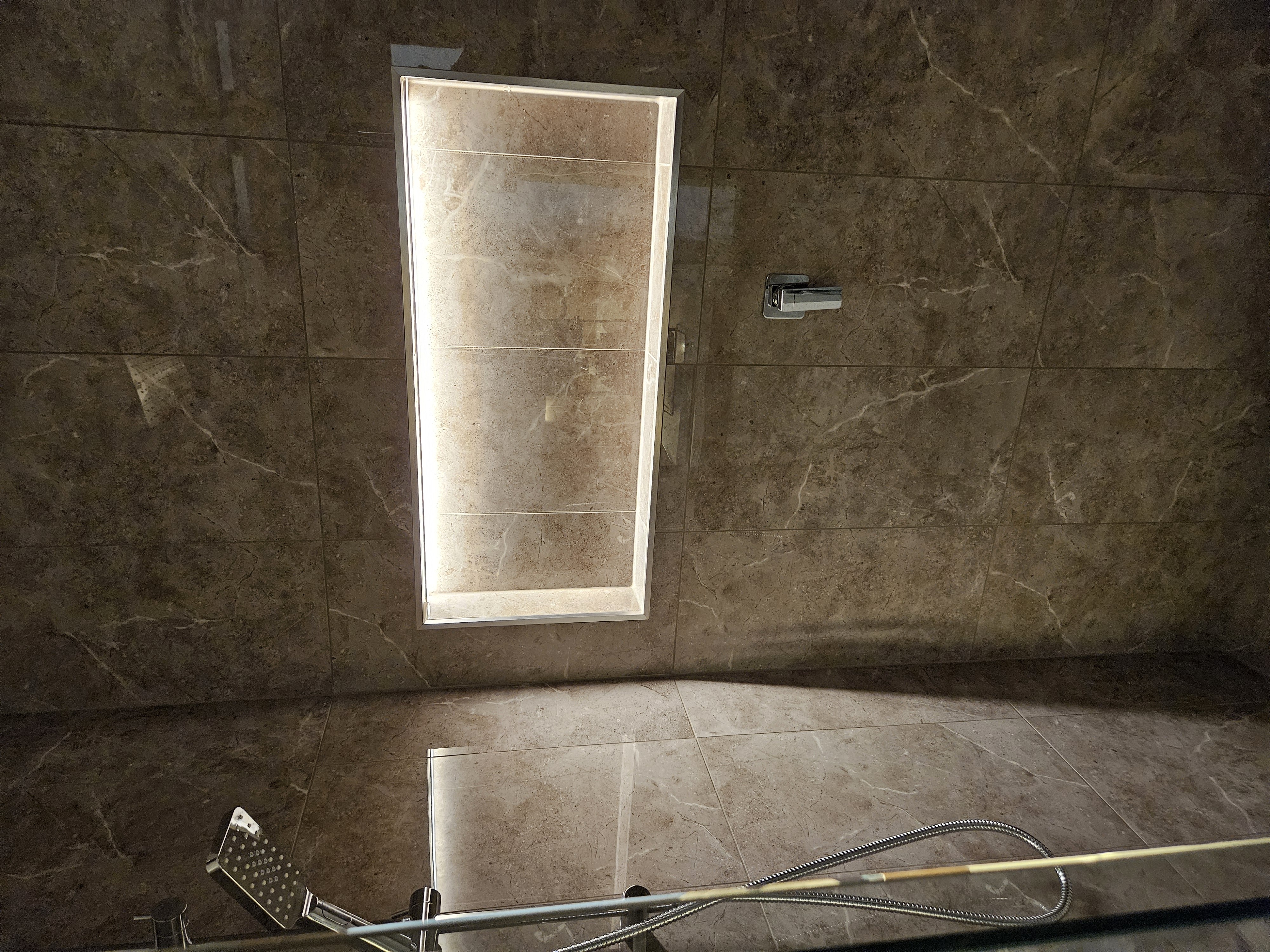 Full width shower shelf lighting